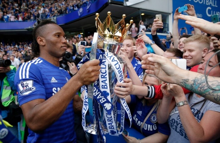 An image od Drogba showing off the trophy to Chelsea Football Club fans