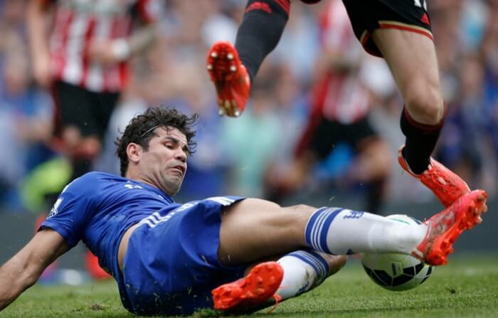 An image of Diego Costa as he tackles a ball