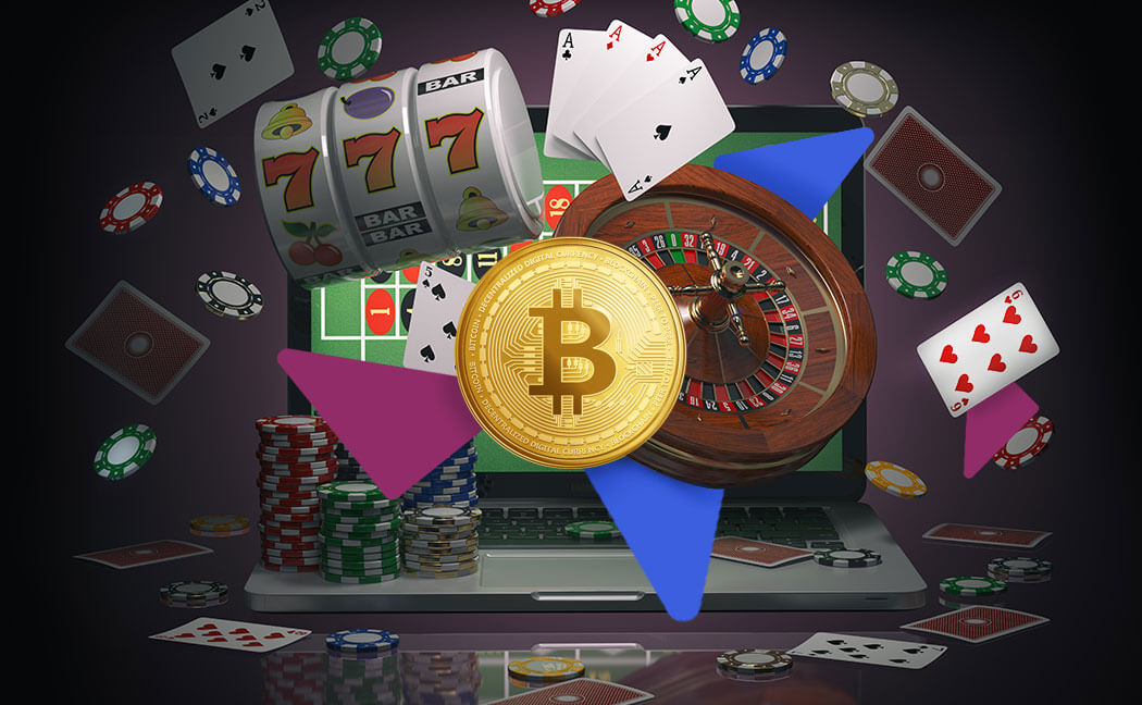 An image showing poker chips, a roulette wheel, playing cards and a laptop behind a Bitcoin symbol