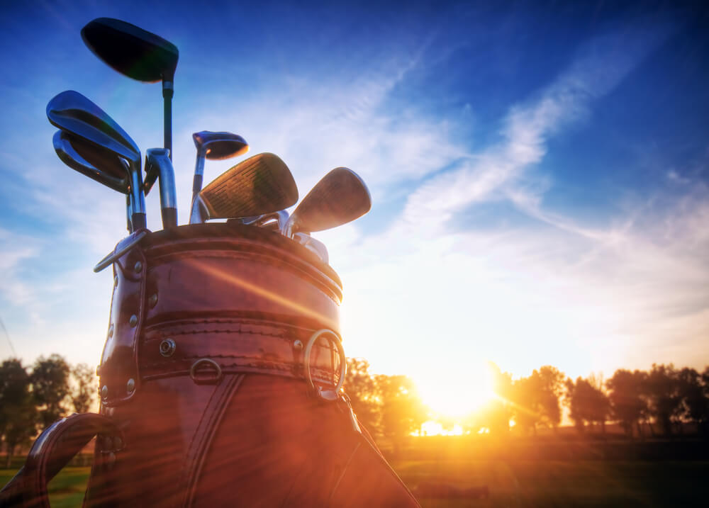 An image of Professional golf gear on the golf course at sunset.