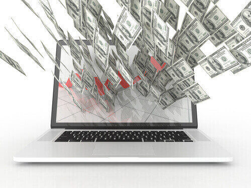 An image of a laptop with money flying out of the screen