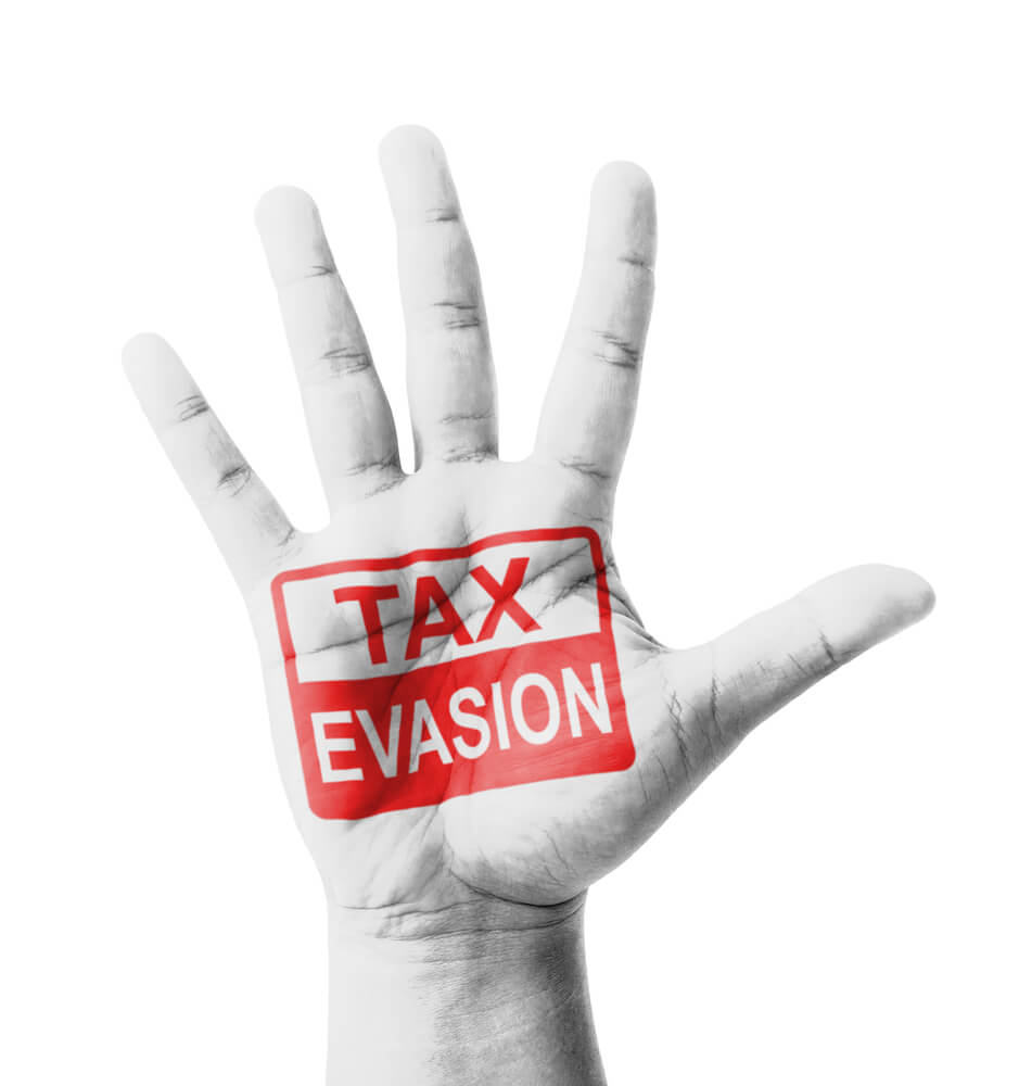 An image of a hand with tax evasion stamped accross